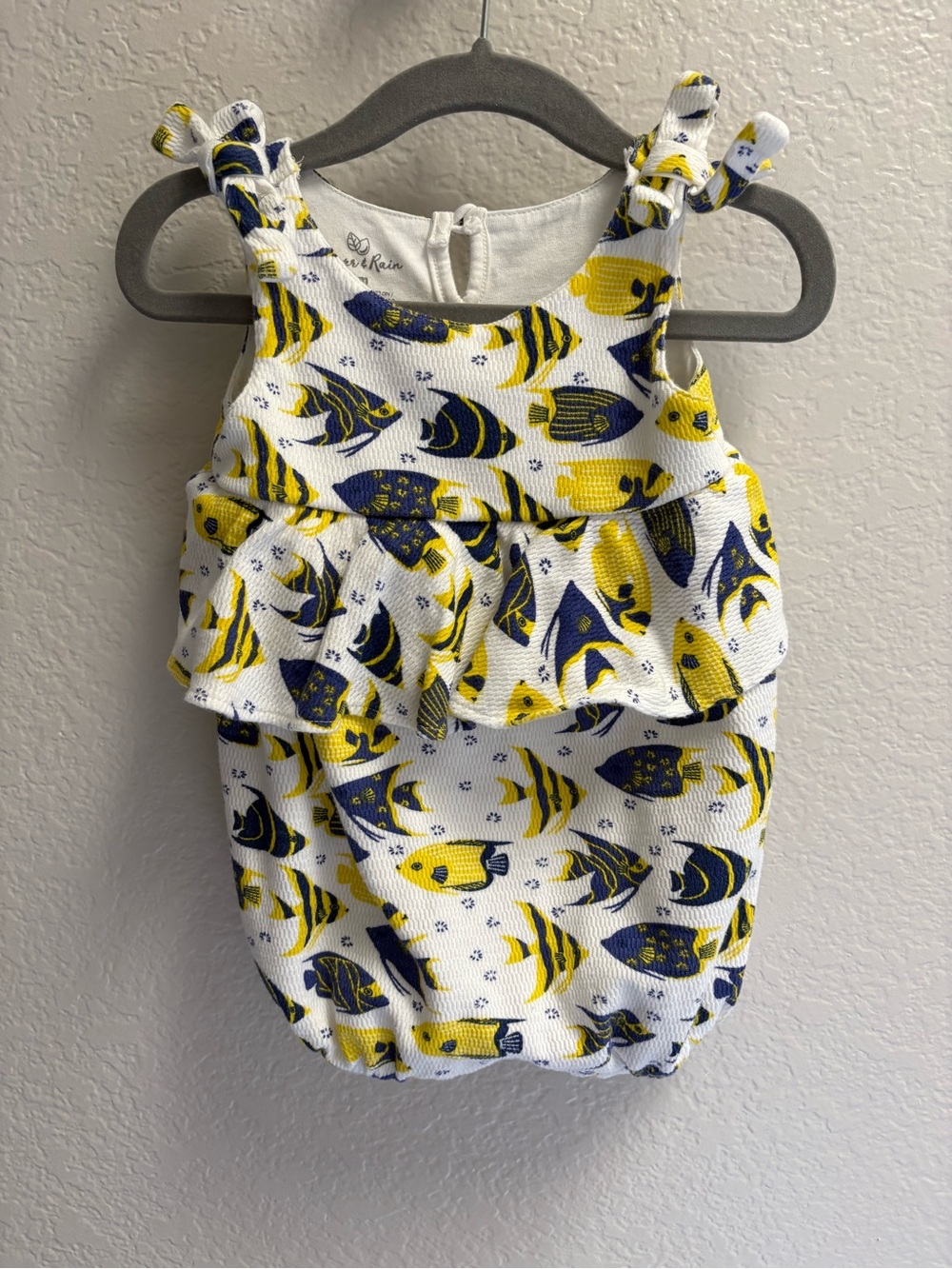 Oliver & Rain Baby Ruffle One-Piece in White with Yellow & Navy Fish Print